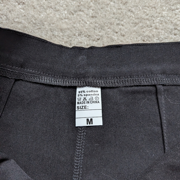 Black shorts with adjustable leg straps - Picture 3 of 6